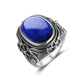 Bague ancienne en argent 925 avec une pierre ovale Lapis Lazuli et des motifs floraux.