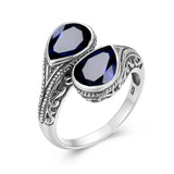 Bague argent 925 avec anneau à motifs et deux saphir bleus taillés en poire.