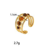 Bague femme pas cher dorée triple anneau avec des pierres rondes marrons sur l'anneau central.