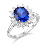 Bague saphir en argent 925 avec une zircone bleue ovale entourée de pierres disposées en forme de pétales