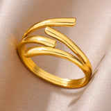 Bagues femme en acier inoxydable doré, avec un design ouvert et des lignes ondulées.