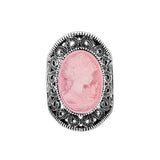 Camée bague avec un anneau en alliage à motif et une pierre rose ovale.