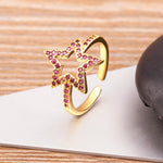 Bague étoile décorée de strass rose, à taille réglable, en cuivre doré.