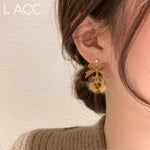 boucle d'oreille pompons