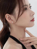 boucles d'oreilles asymétriques tendance