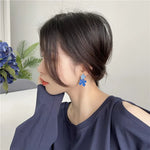 boucle d'oreille bleue