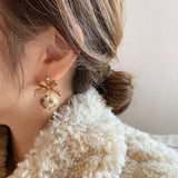 boucle d'oreille pompons