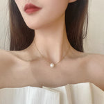 collier une perle blanche