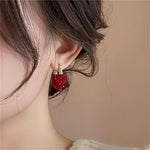 boucles d oreilles rouges