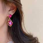 boucle d'oreille fushia