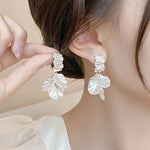 boucles d oreilles blanches