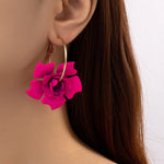 boucle d'oreille rose fushia