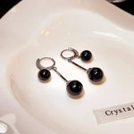 boucles d'oreille perle noire