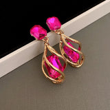 boucle d'oreille fushia