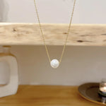 collier une perle blanche