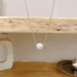 collier une perle blanche