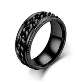 Bague anti stress homme en acier noir avec une chaîne rotative autour de son anneau.