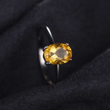 Bague citrine en argent massif avec une citrine ovale jaune.