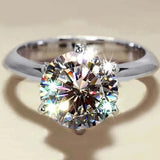 Bague de fiançailles pour femme en argent sterling 925, avec une pierre moissanite scintillante.