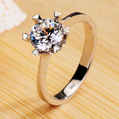 Bague de promesse en argent 925 avec une grosse pierre scintillante en zircone.