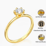Bague fine or jaune AU750 18 carats avec une petite pierre solitaire.