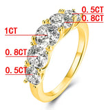 Bague or et diamant avec un anneau en or jaune orné de 5 pierres moissanites.