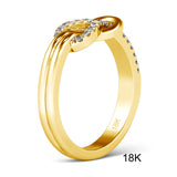 Bague or moderne faite en or jaune 18 carat avec un noeud pavé de zircones.