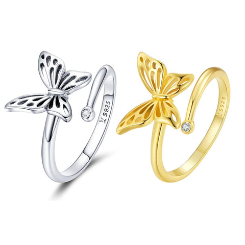 Deux bagues papillons en argent, une argentée et une dorée.