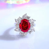 Bague rubis diamant pour femme avec anneau en argent, rubis ovale entourée de zircones.