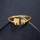 Bagues dents en acier inoxydable doré.