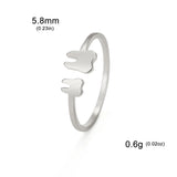 Bagues dents à taille ajustable couleur argentée avec deux pendentifs dents.