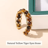 Bagues en perles oeil de tigre avec un anneau réglable en cuivre doré.