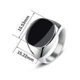 Chevalière homme argentée avec une pierre noire ovale avec ses dimensions de 15.53mm et 15.23mm.