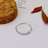 Bague anti stress en argent 925 avec dix perles rotatives, à taille ajustable.
