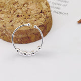 Bague anti stress en argent sterling 925 avec 7 boules rotatives, 4 billes lisses et 3 billes gommées.